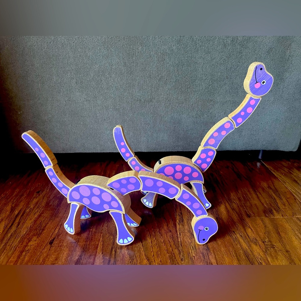 Pair of Two Melissa and Doug Wooden Dinosaur Grasping Toys